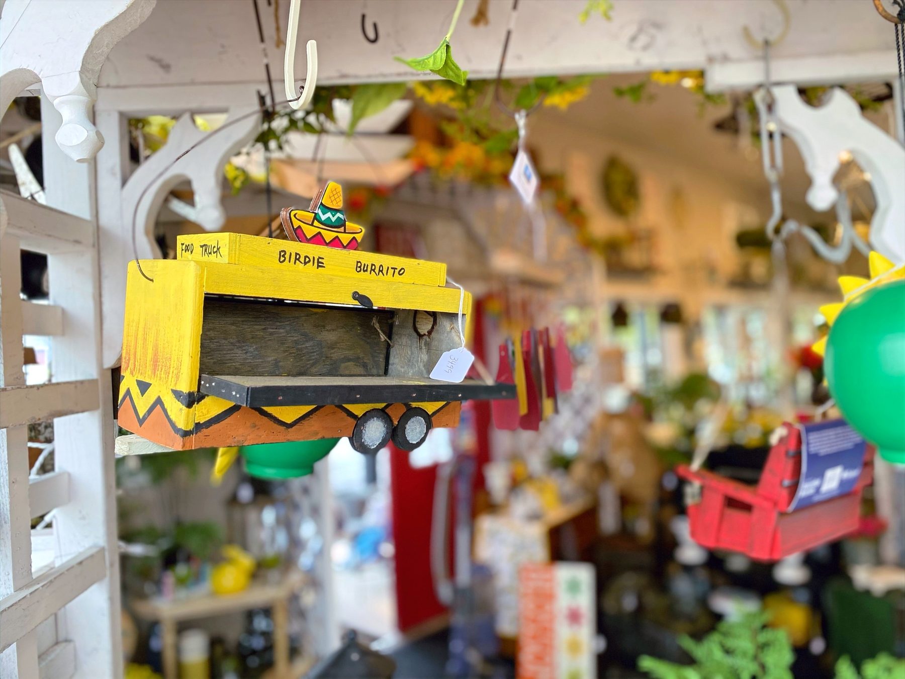 Decorative birdhouse hanging in the Zerrillo Gardens gift shop